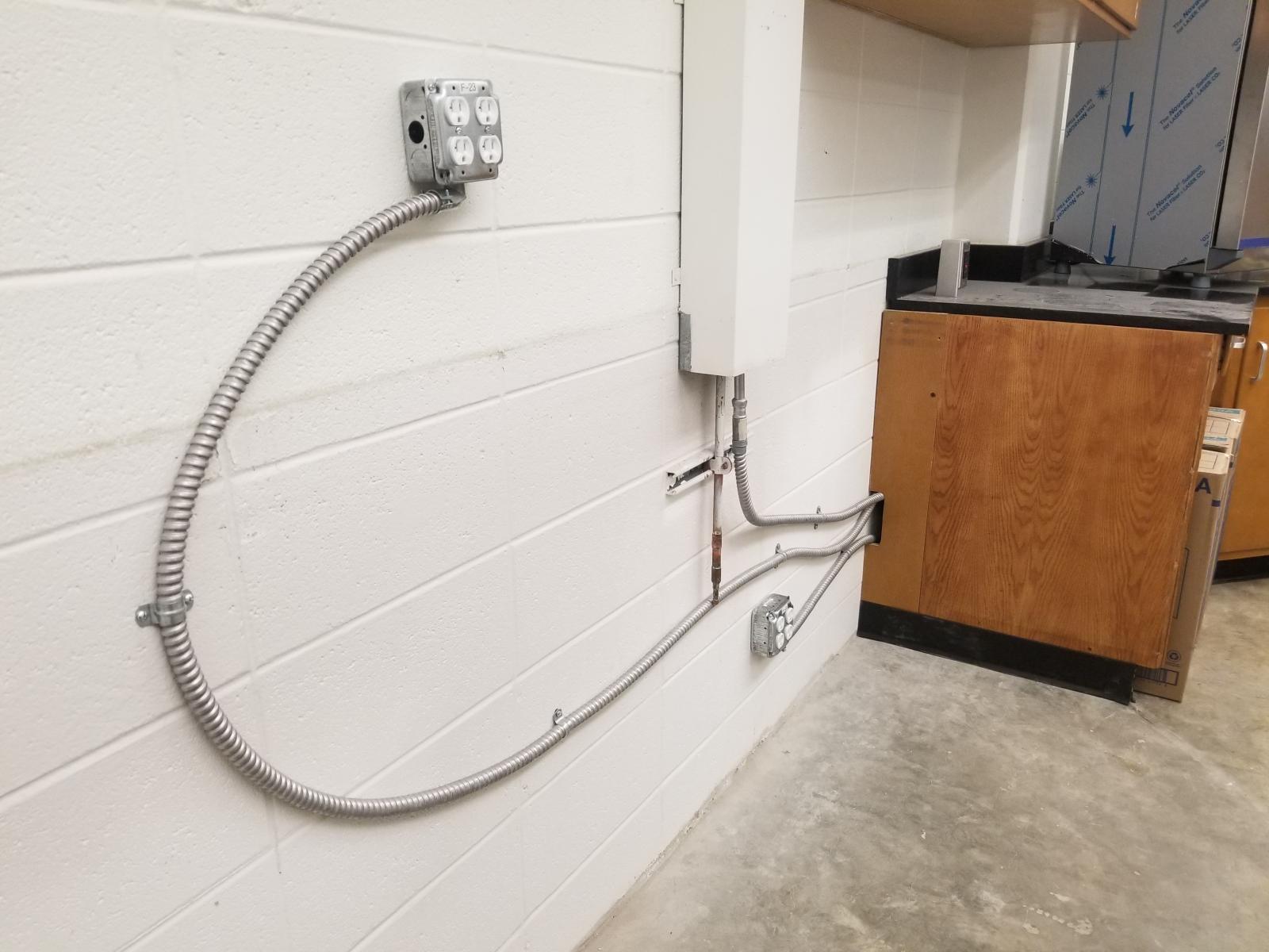 Cabinets removed. Electrical rerouted.