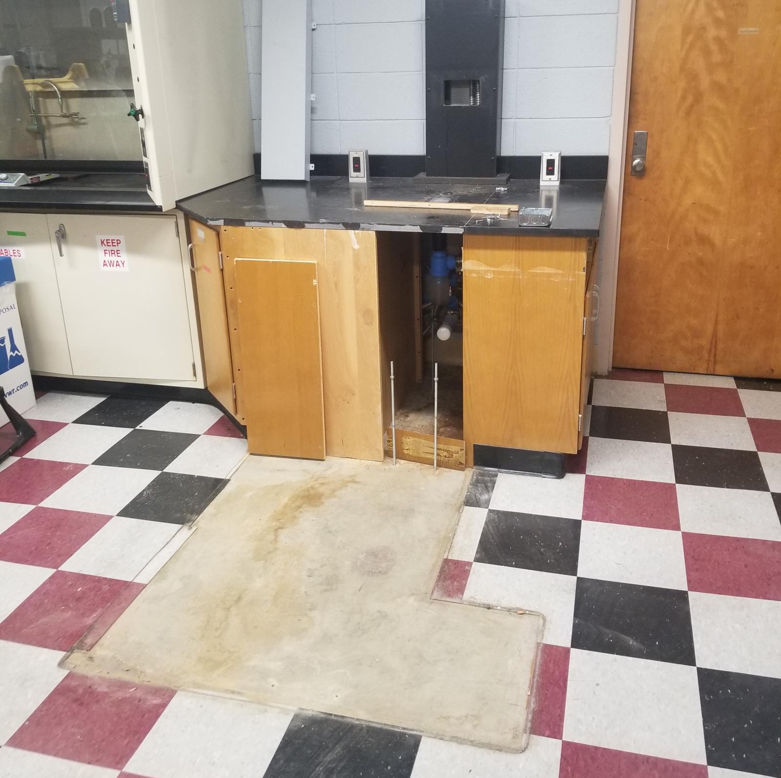 Capped plumbing and removed cabinetry.