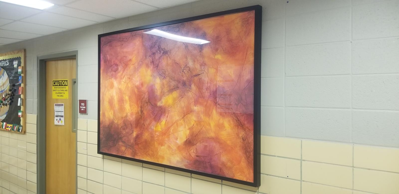 Hung up paintings on the first floor of Hand Lab