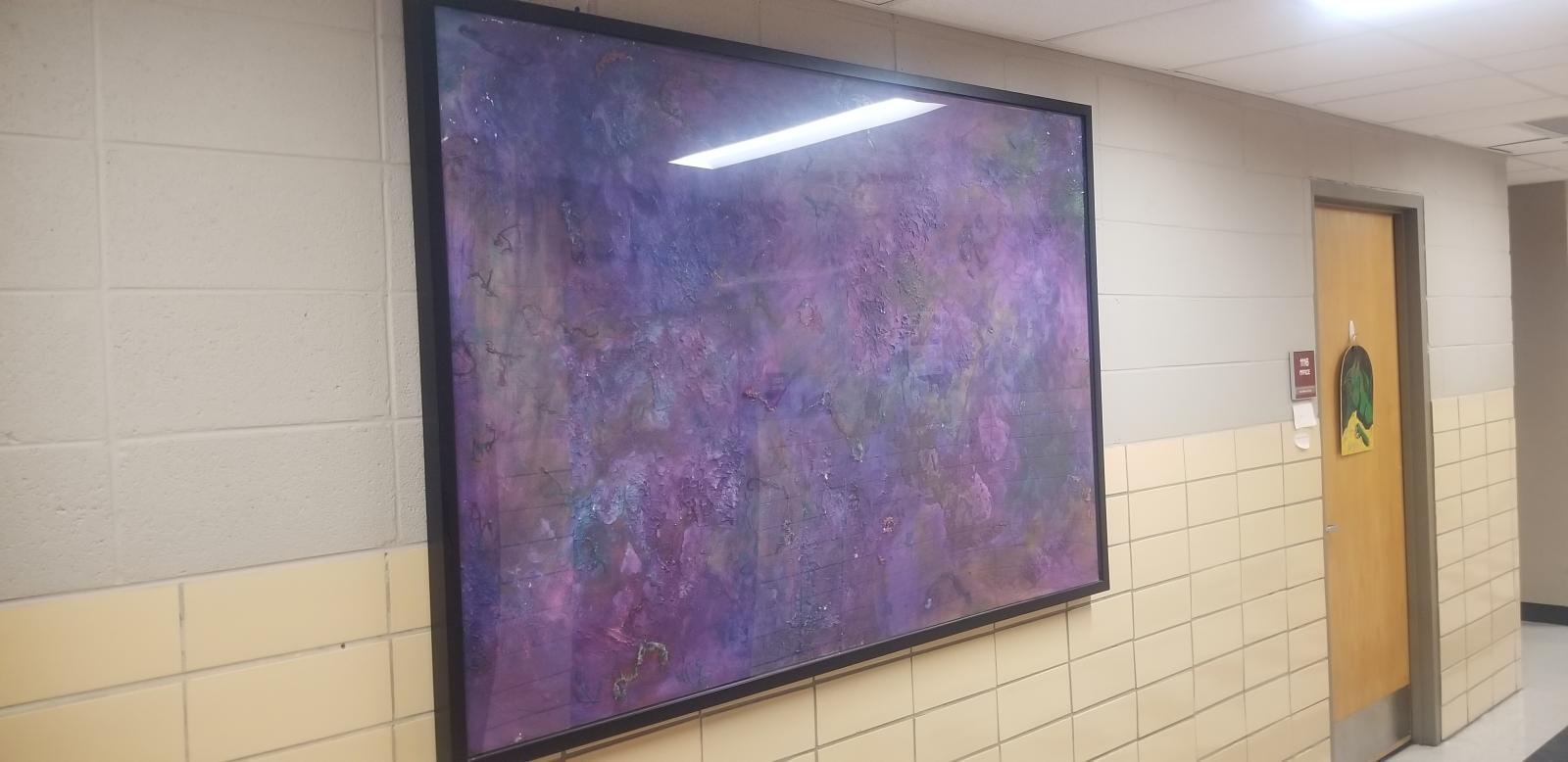 Hung up paintings on the first floor of Hand Lab