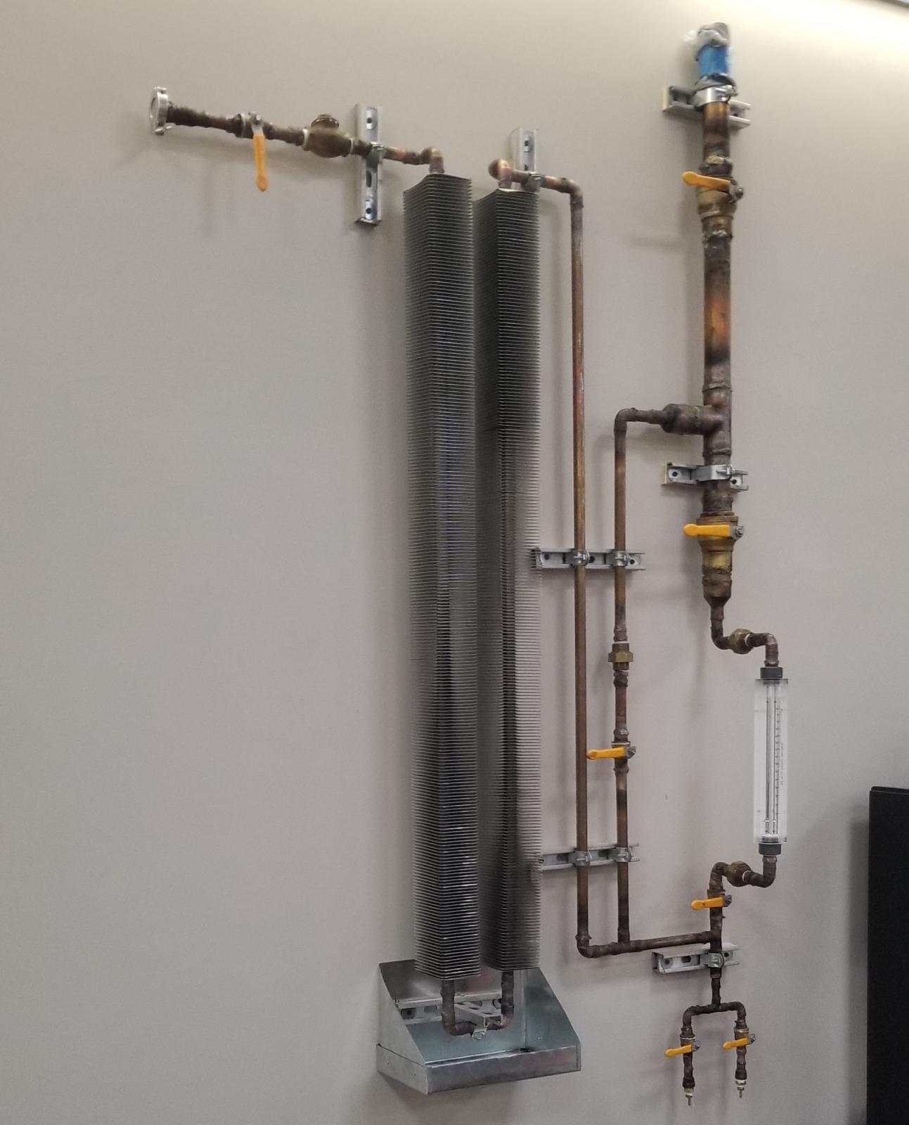 Manifold mounted to wall
