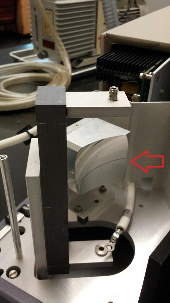 Replacing a scuffed collection mirror on the fluorometer.